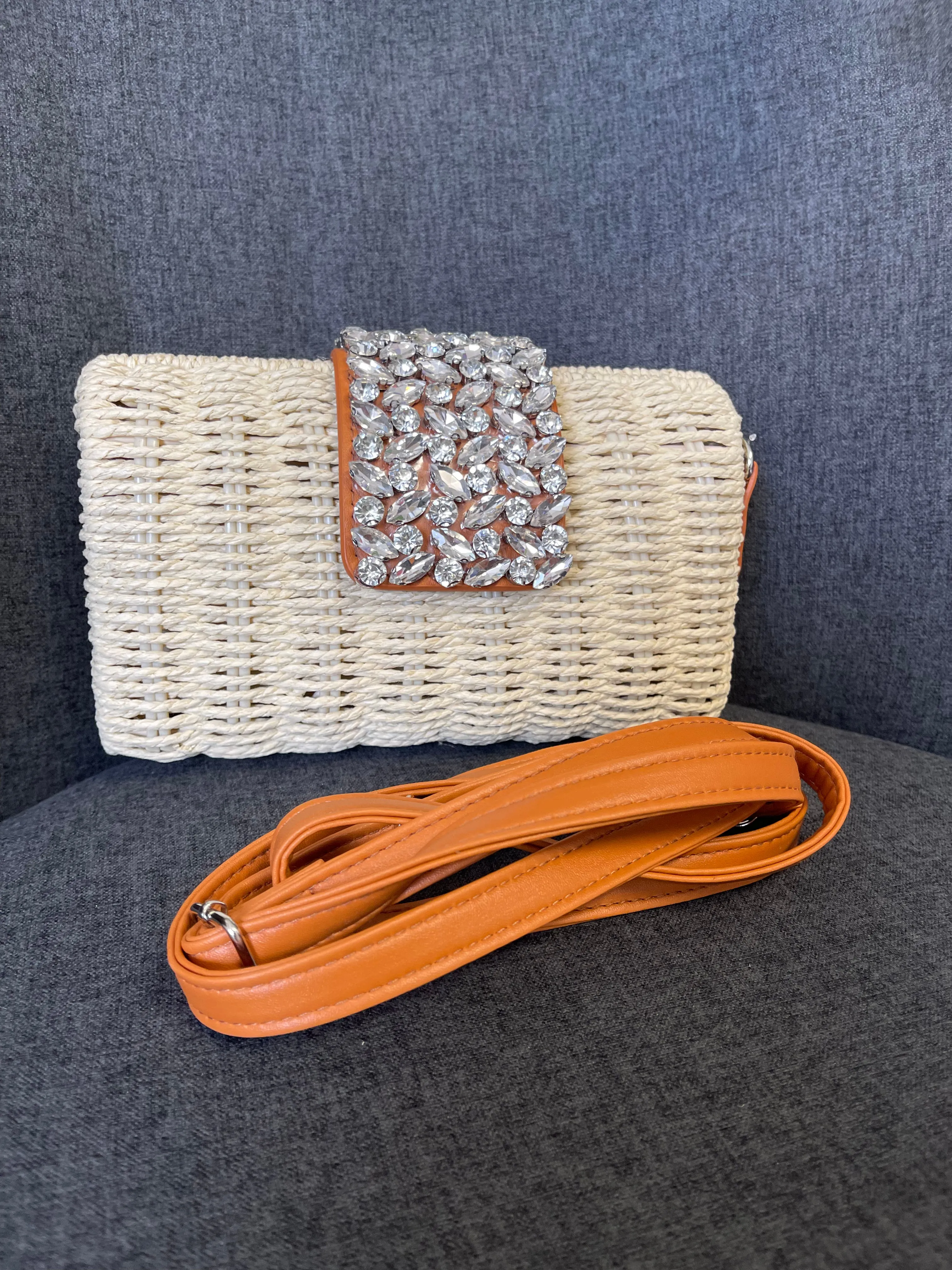 Nicole woven clutch bag