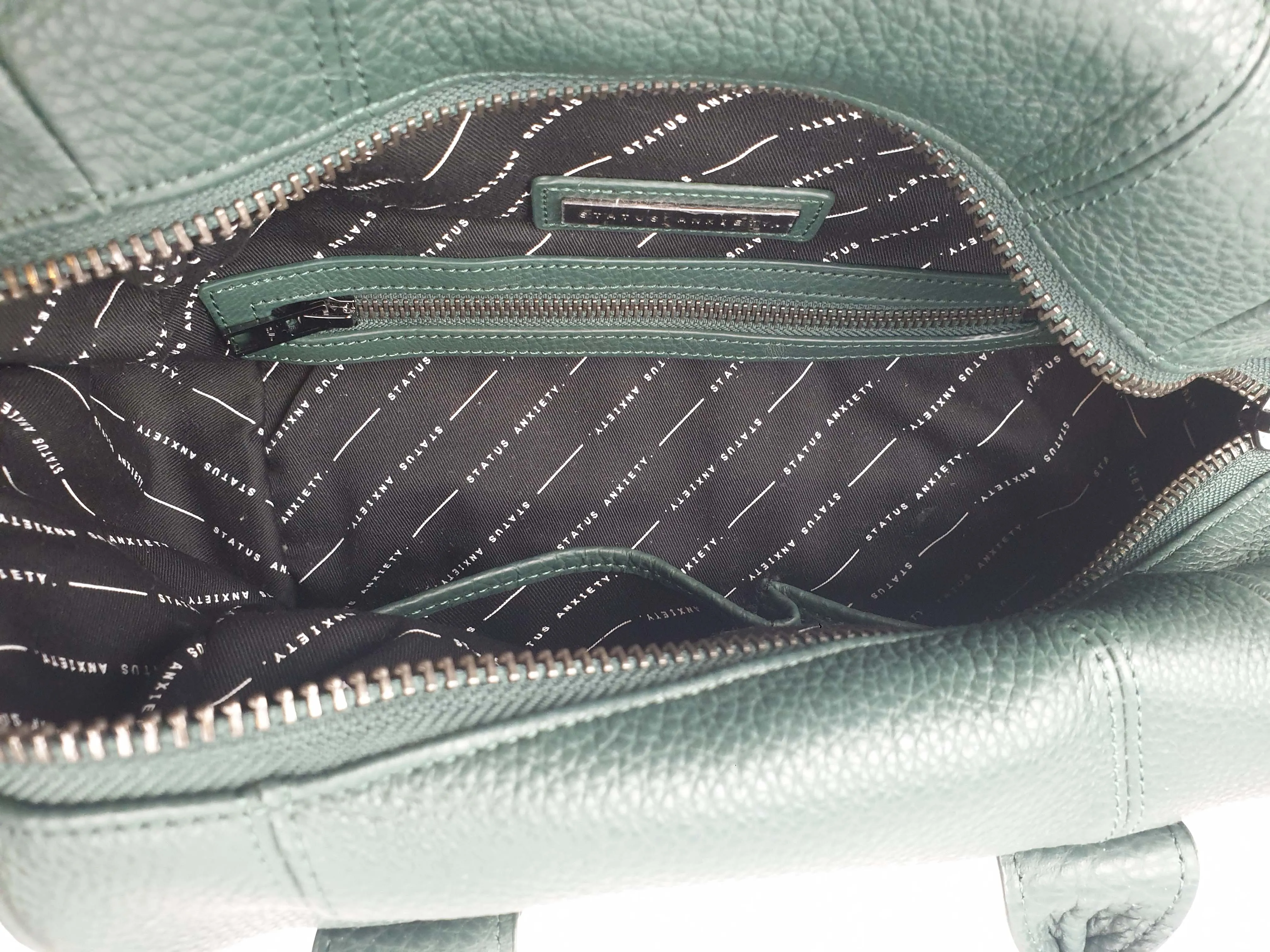 Status Anxiety green leather bag