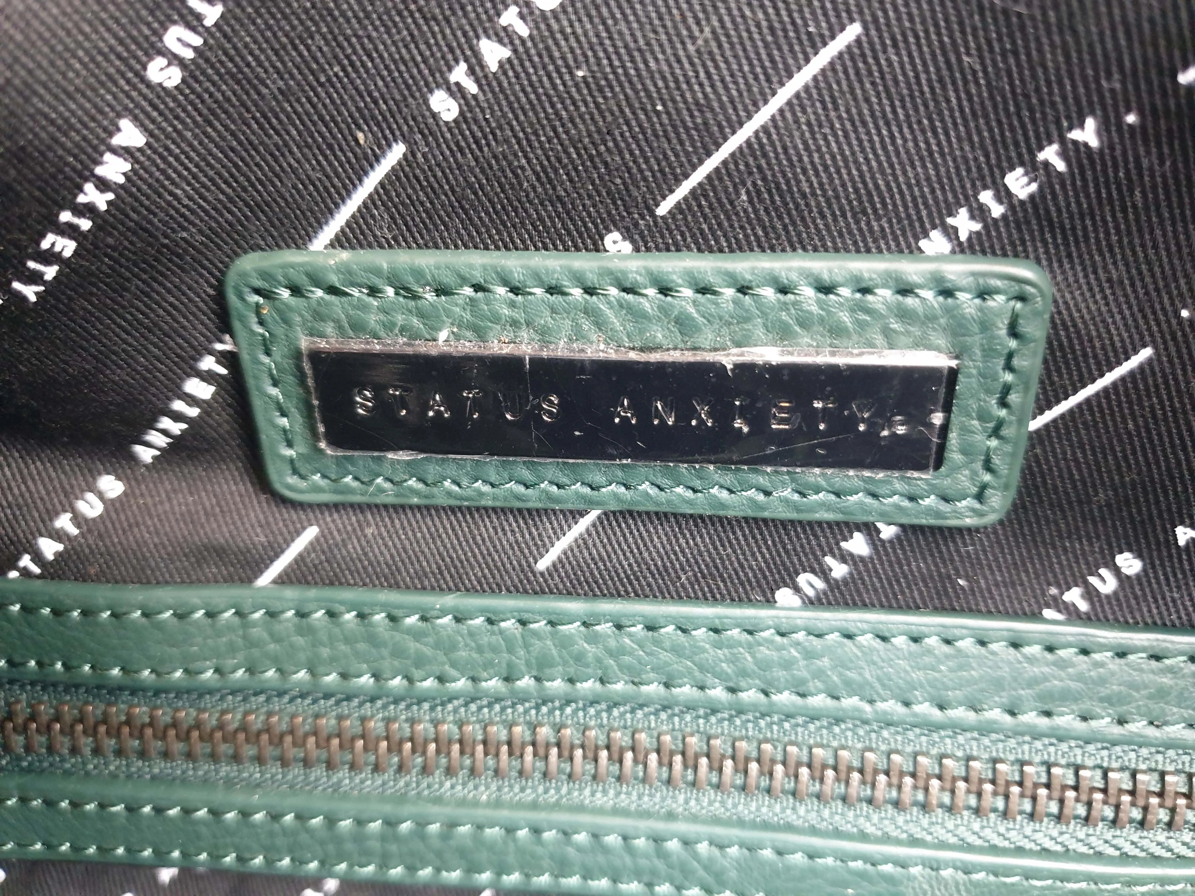 Status Anxiety green leather bag