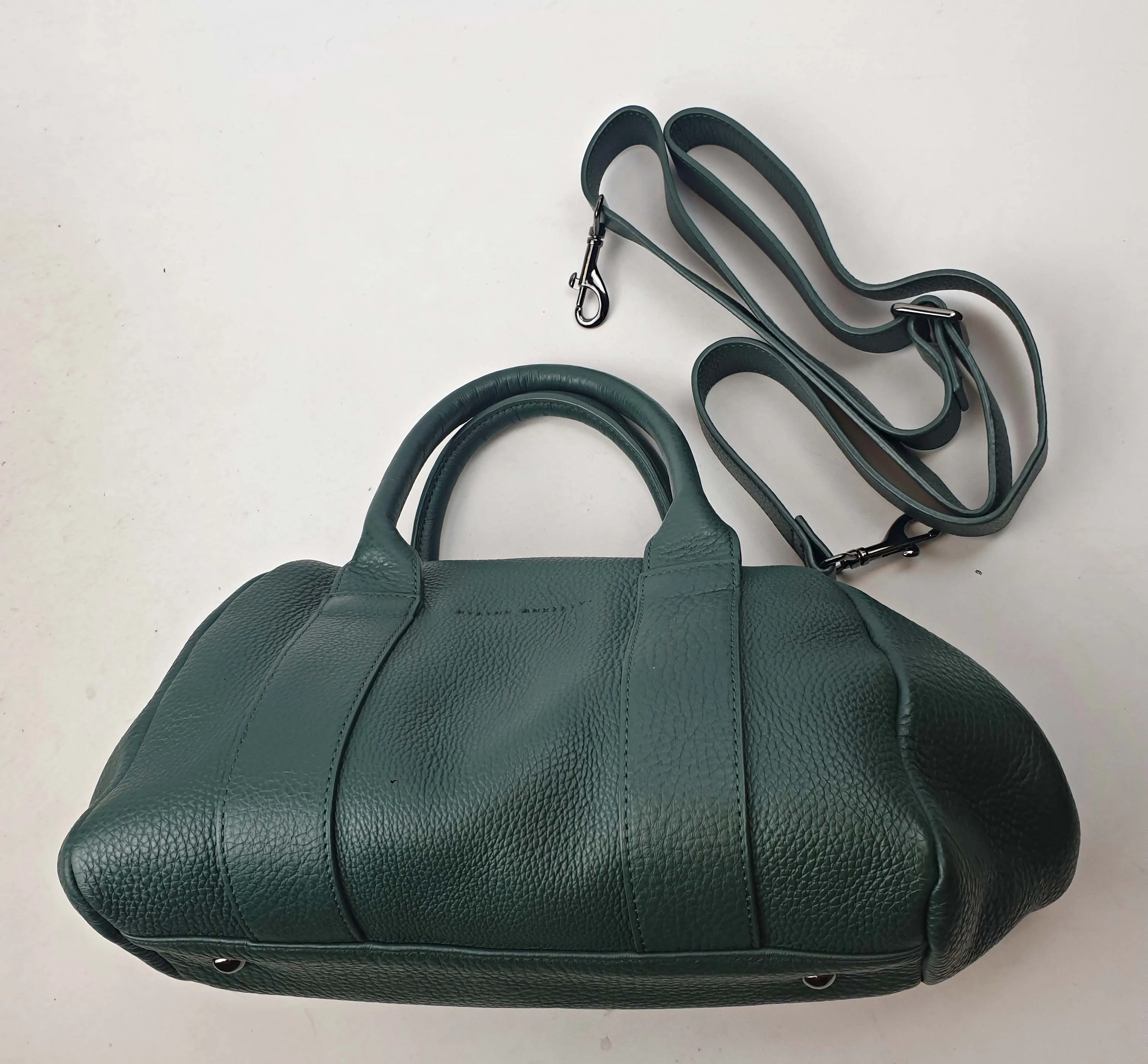 Status Anxiety green leather bag