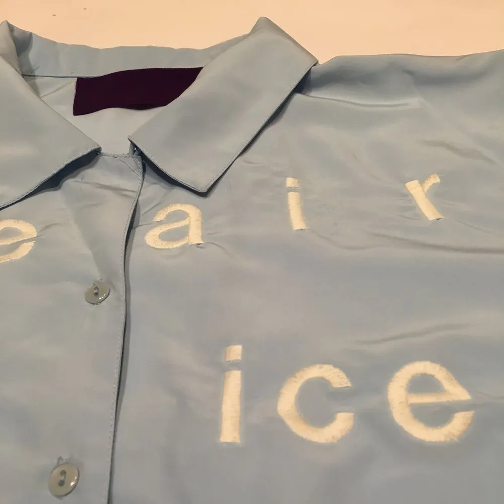 “This is not a fairy tale” oversized button down shirt sky blue